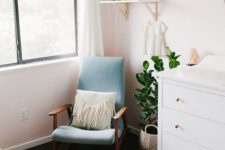 23 Poang chair re-upholstered in blue and stained to fit the nursery decor