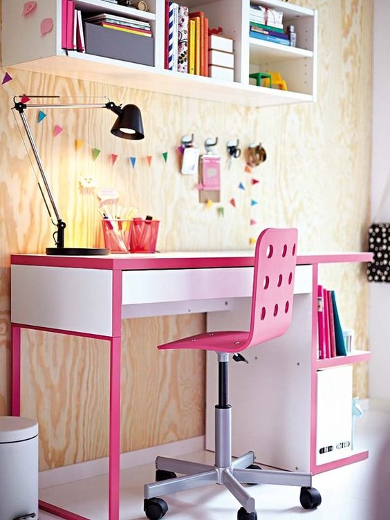 a colorful IKEA Micke hack with pink touches for a little girl's workspace