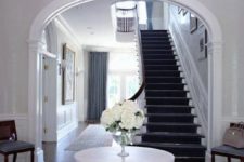 24 an oversized crystal ball chandelier to add a glam feel to your entry