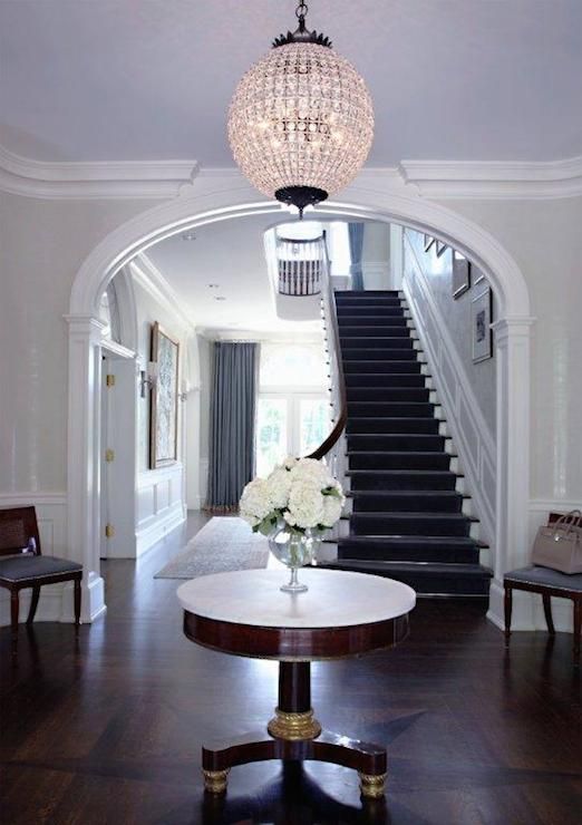 an oversized crystal ball chandelier to add a glam feel to your entry