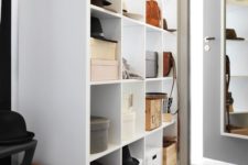 25 IKEA Kallax unit used for bag and hat storage in the dressing room