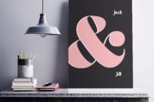 25 a stylish modern ampersand sign with a black backdrop and a large pink ampersand