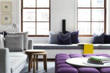25 an oversized upholstered purple ottoman spruces up the neutral space and adds a touch of color