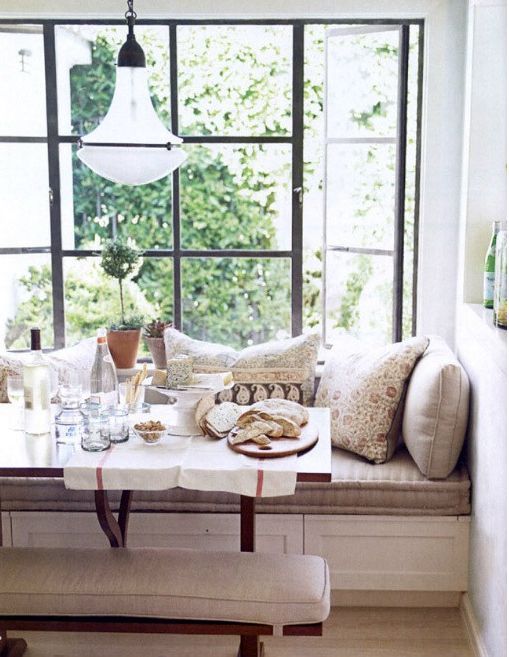 an upholstered windowsill bench with drawers is an ideal seat for any eating space