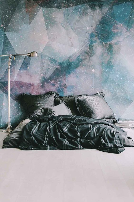 galaxy-inspired wall mural makes a bold statement in the space