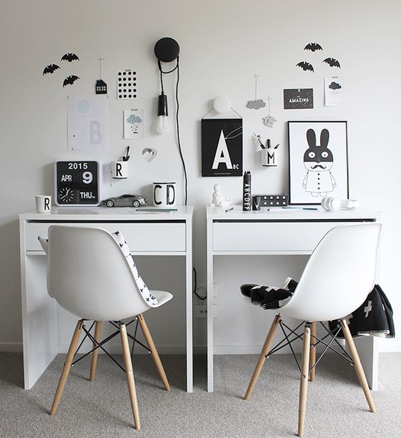 a double study space for kids done in Scandinavian style and in a laconic black and white color scheme
