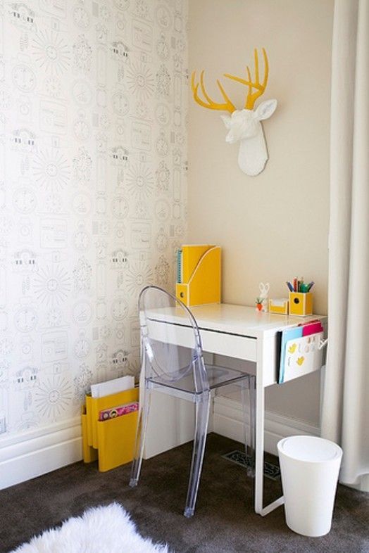 a small and fun kid's workspace with a Micke desk, an acrylic chair and some bold yellow touches