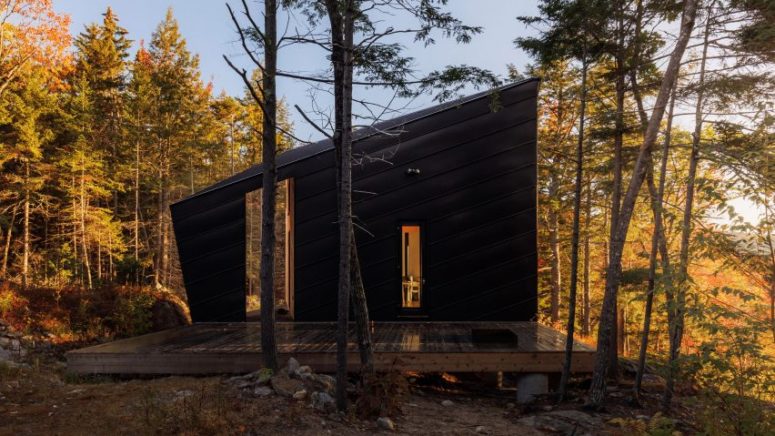 This angular forest cabin was designed as a weekend retreat for a couple with two kids