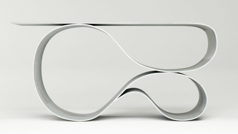 Whorl console table is made of fabric concrete and it features a unique shape
