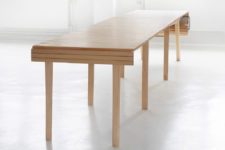 02 The table features some wooden slats and a crank to make it larger or smaller when needed