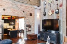 02 a loft with a masculine feel and a guitar display over the TV