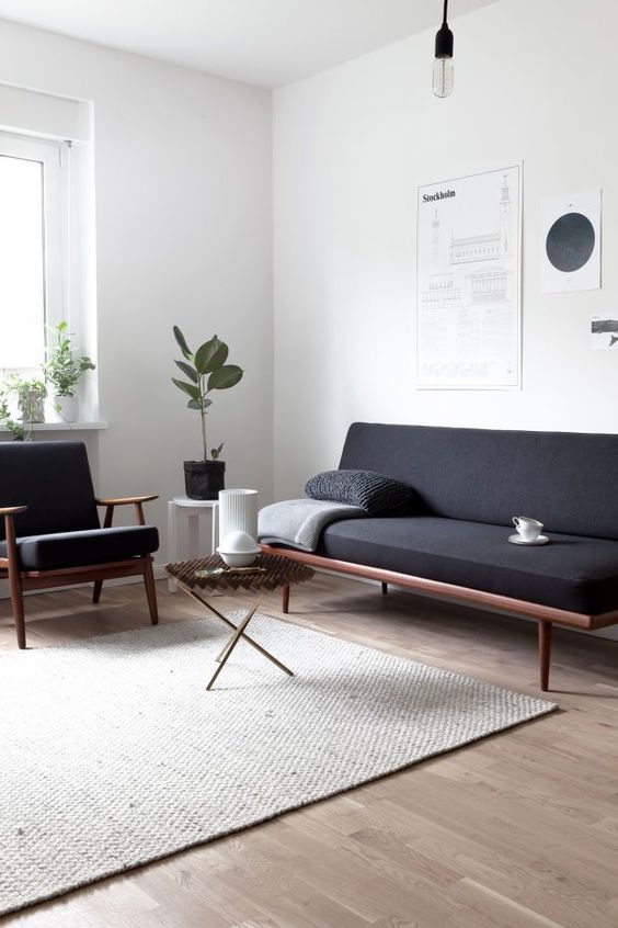 a minimalist living room with a blank corner that brings a comfortable feeling to the room
