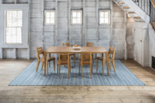 03 Tula dining table and chairs on the Amma area rug that features blue stripes