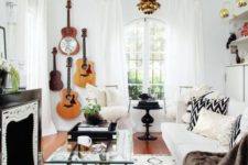 03 a boho living room accented with guitars on the wall in the corner