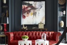 03 a bold red leather Chesterfield makes a colorful statement in this moody space