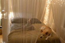 04 a sheer fabric canopy with string lights to highlight the sleeping space and make it comfier