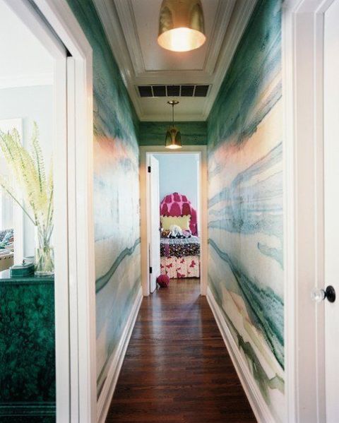 make a long and boring corridor bold and chic with green agate wallpaper and brass touches