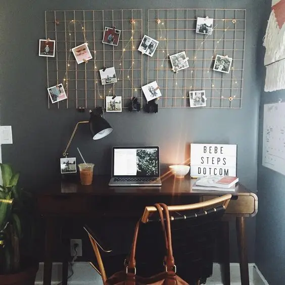two grid boards with photos and lights that add a cute touch and highlight the boards