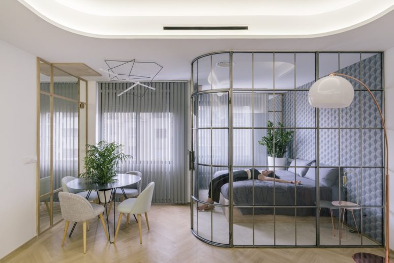 open up your apartment using glass walls, so there won't be bulky dividers