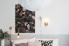 06 a pretty floral wall art and a fluffy chandelier that reminds of a large bloom