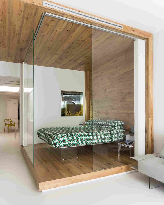 a small glass covered bedroom with acrylic furniture for a contemporary feel