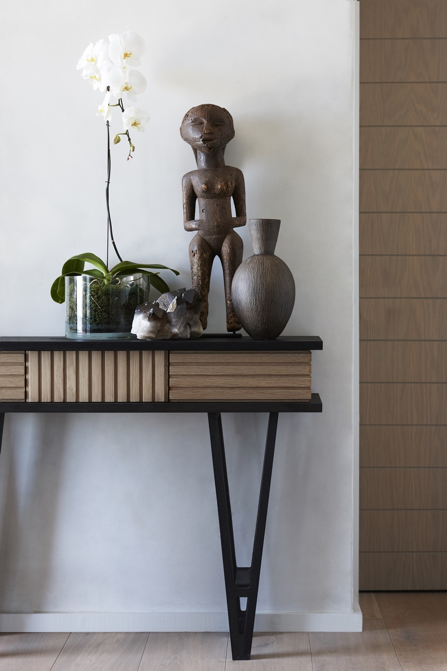 Most of furniture, like this console table, was custom-made to show off a modern take on traditional African culture