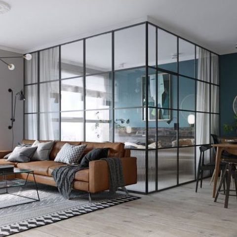 a framed glass bedroom to divide it from the dining and living spaces plus curtains for more privacy