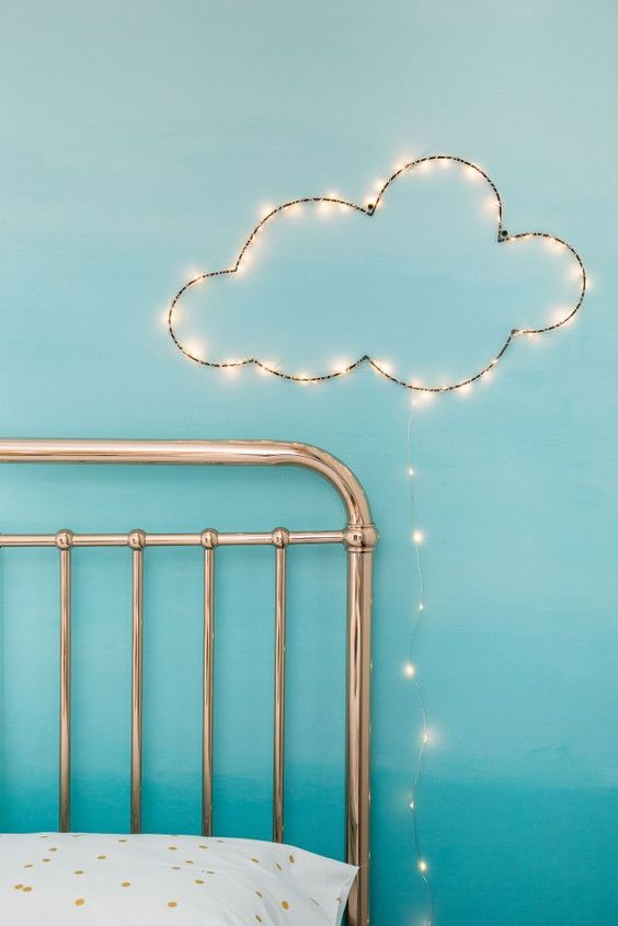 a little cloud of string lights over the bed will make any sleeping space cuter and will add light here
