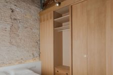 08 The wooden partitions are practical and can be used as a large wardrobe