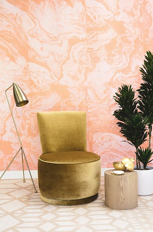 pink agate wallpaper and brass items make this nook very glam