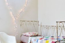 09 a heart of string lights makes the space cozier and matches the forged bed