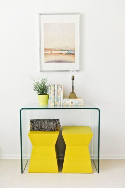 lemon yellow stools and a matching planter with greenery for minimalist spring decor