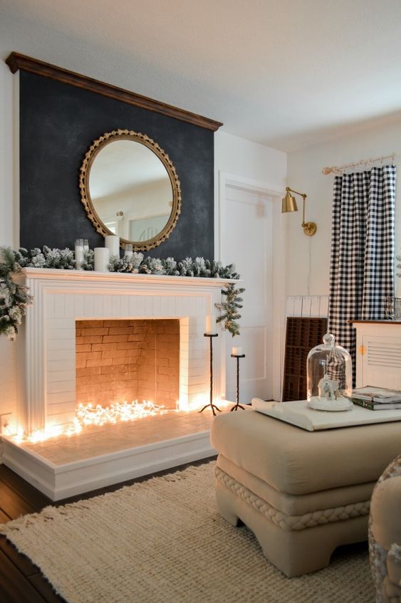 Put some string lights into the fireplace to imitate light   it will instantly add coziness