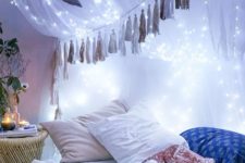 09 string lights attached to the bed canopy create a galaxy-like effect and look wow