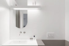 10 The bathroom is done in grey and white, with minimalist and geometric details