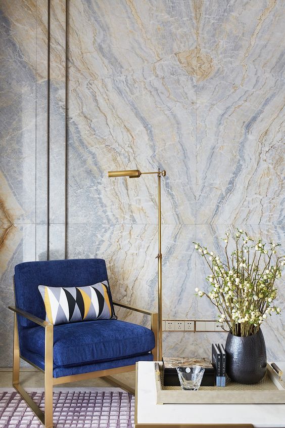 delicate blue and gold geode wallpaper perfectly matches the furniture and lamp