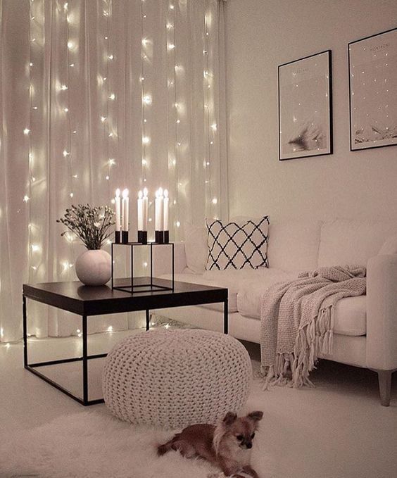 string lights added to the sheer curtains are a great way to add glam to the space