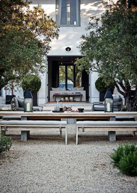This is an outdoor dining space designed with the same blue touches as you can see in other spaces