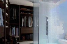 12 a glass enclosed shower right in the closet not to make this small space ven smaller