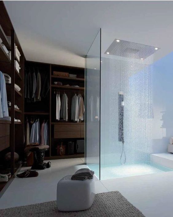a glass enclosed shower right in the closet not to make this small space ven smaller
