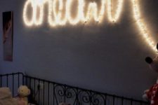 12 a string light sign over the bed to inspire your kid