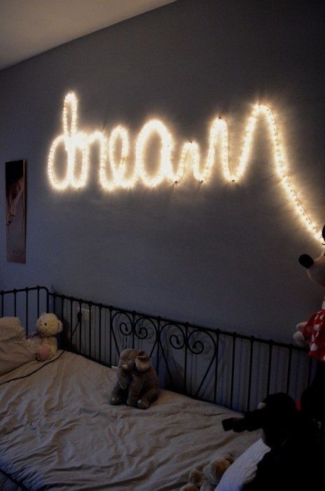 a string light sign over the bed to inspire your kid