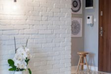 12 make the entryway more interesting with exposed white brick walls