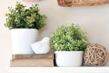 12 potted greenery in white planters is all that you need for a fresh spring mantel
