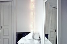 12 string lights hung on a hook in the corner bring enough light to a small entry