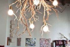 13 a fantastic branch chandelier with bulbs steals the show in this room