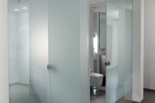 13 a glass cube bathroom done with blue frosted glass to make it more private and comfortable
