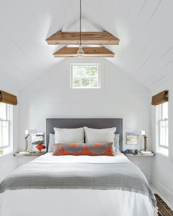 a modern farmhouse bedroom with negative space that makes it feel larger