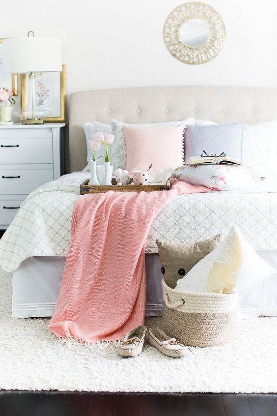 go for some pastel-colored pillows to make your bed feel spring-like
