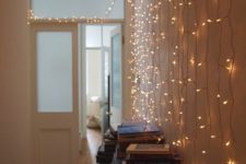14 string lights on the wall will make the entryway more welcoming
